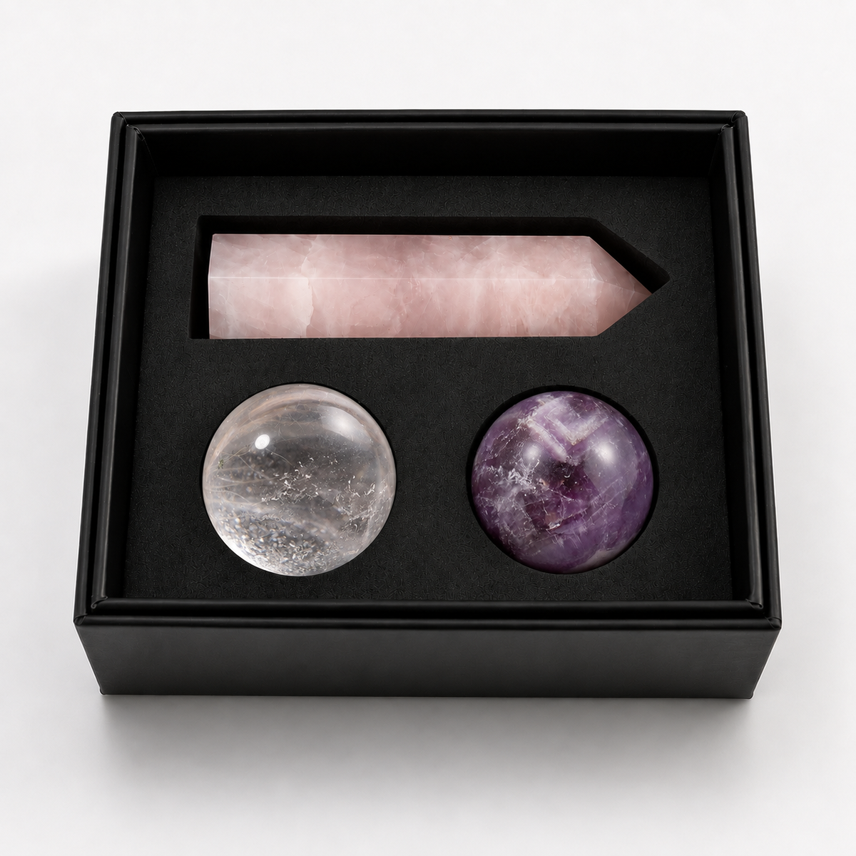 GLISPARK Soft Dream Crystal Set in an open black gift box with a rose quartz tower, clear quartz sphere, and dream amethyst sphere.
